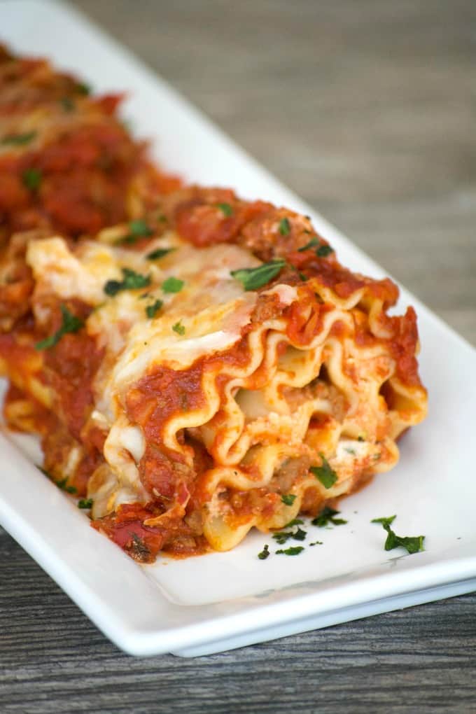 Cheese filled lasagna rolls topped with a flavorful meat sauce - a meal you can't help but share. Share them for your Glad to Give meal to see the smiles.