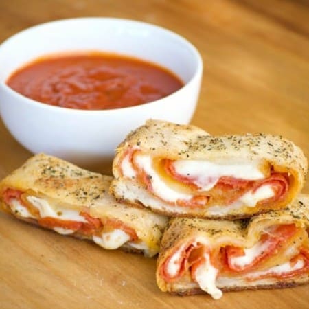 Pepperoni Bread - refrigerated pizza dough, pepperoni and provolone cheese rolled up to make one heck of an appetizer. Remember the marinara for dunking!