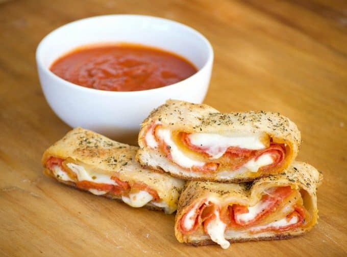 Pepperoni Bread - refrigerated pizza dough, pepperoni and provolone cheese rolled up to make one heck of an appetizer. Remember the marinara for dunking!