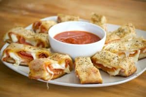 Pepperoni Bread - refrigerated pizza dough, pepperoni and provolone cheese rolled up to make one heck of an appetizer. Remember the marinara for dunking!