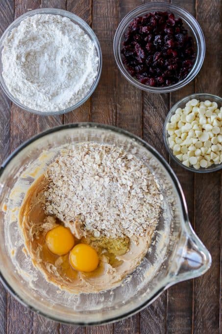 Making cookies with dried cranberries and white chocolate chips.