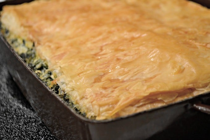 Spinach, onion, herbed Feta cheese in between layers of Phyllo dough create an easy and delicious Spanakopita that makes plenty to serve everyone.