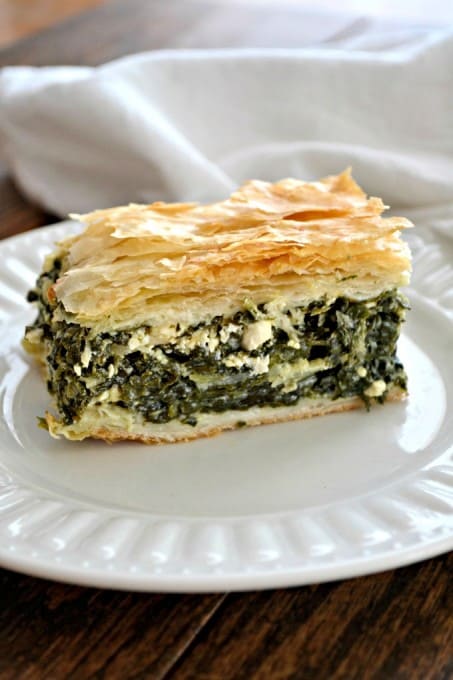 Spinach, onion, herbed Feta cheese in between layers of Phyllo dough create an easy and delicious Spanakopita that makes plenty to serve everyone.