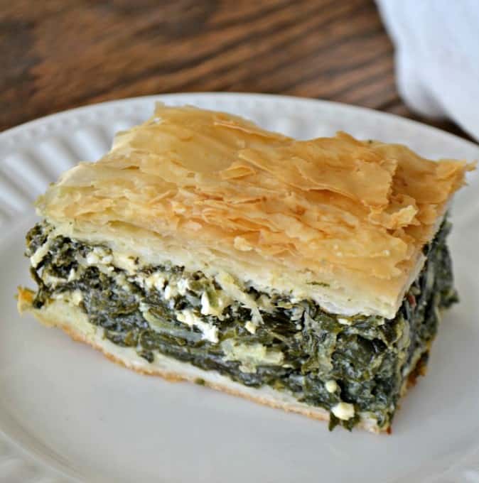 Spinach, onion, herbed Feta cheese in between layers of Phyllo dough create an easy and delicious Spanakopita that makes plenty to serve everyone.