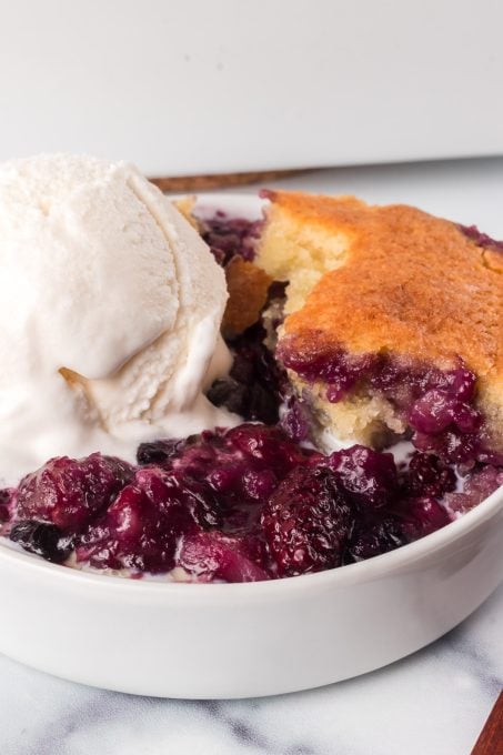 An easy fruit cobbler made of three berries.