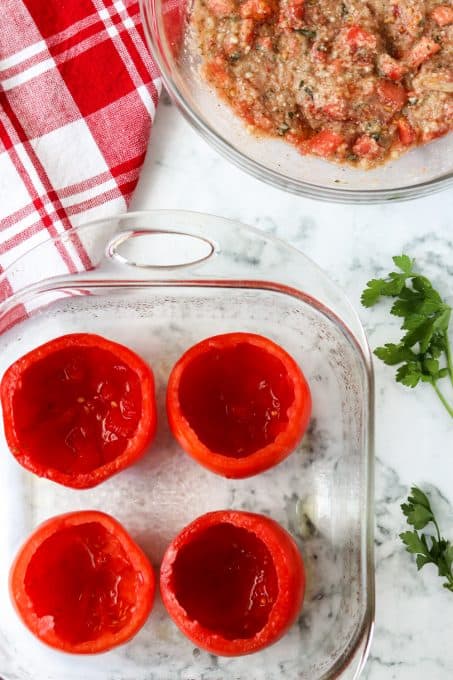 Hollowed out tomatoes before being stuffed.