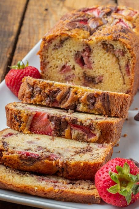 A quick bread with strawberries and melted chocolate.