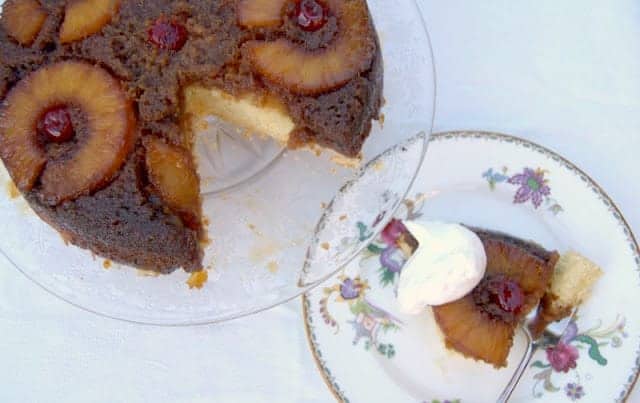 A soft cake covered with a delicious brown sugar crust, sliced pineapples and maraschino cherries -YUM!
