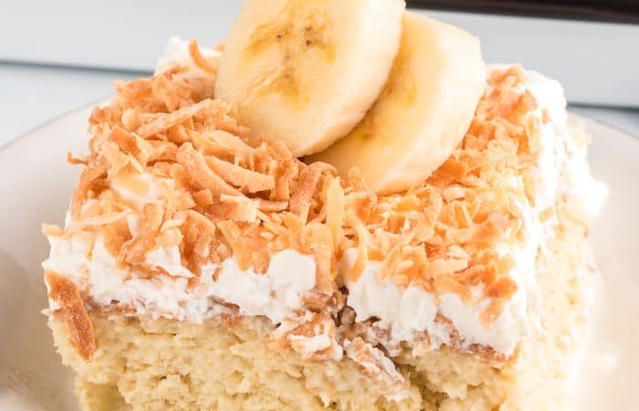 Toasted coconut on a tres leches cake made with bananas.