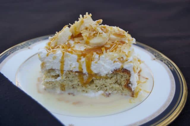 Banana Tres Leches Cake - an outstandingly moist and delicious cake flavored with banana, topped with toasted coconut and sliced bananas.