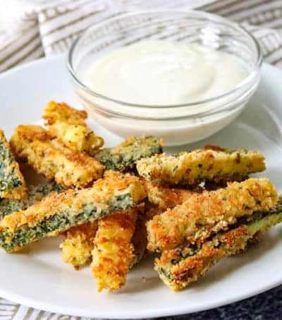 Bake Parmesan Zucchini Sticks with Ranch dressing.