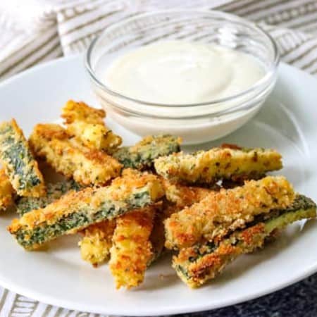 Bake Parmesan Zucchini Sticks with Ranch dressing.