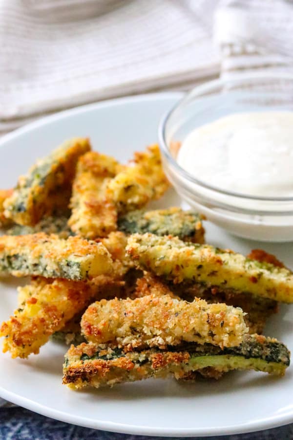 Parmesan Zucchini Sticks on a plate with Ranch dressing.