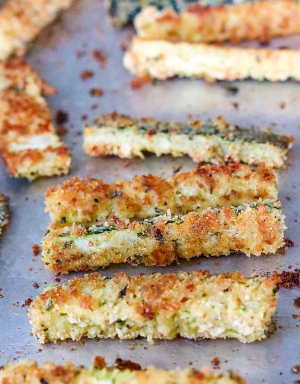 Baked Parmesan Zucchini sticks on a baking sheet.