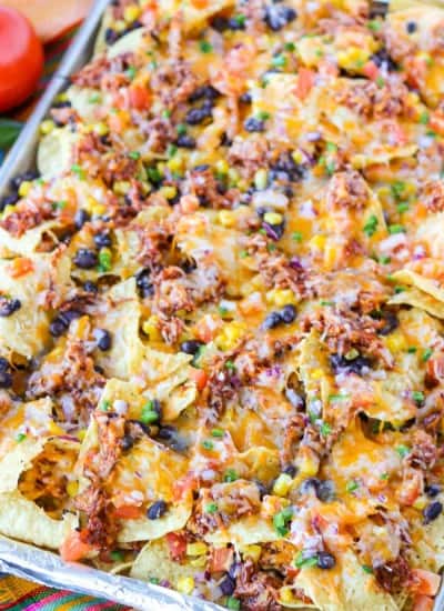 Layers of deliciousness on tortilla chips.