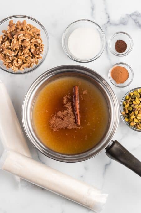 Making honey syrup to pour over Baklava.