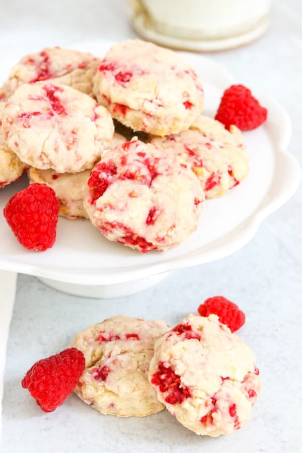 Easy Raspberry Cream Cheese Scones on a cake plate.