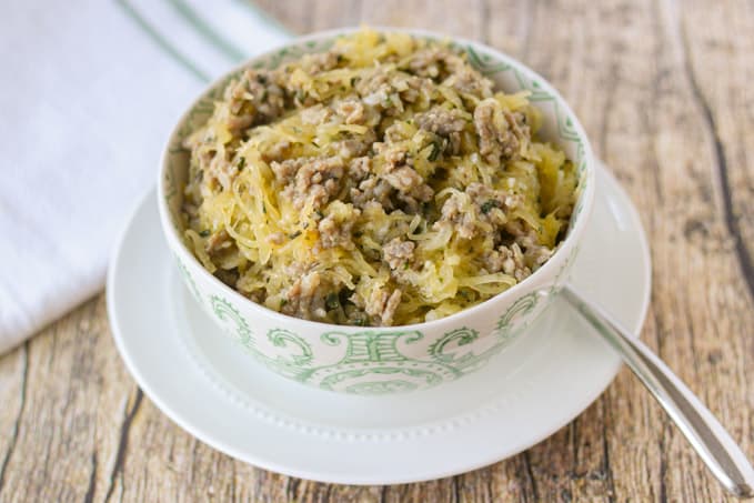 A bowl of sausage and spaghetti squash.