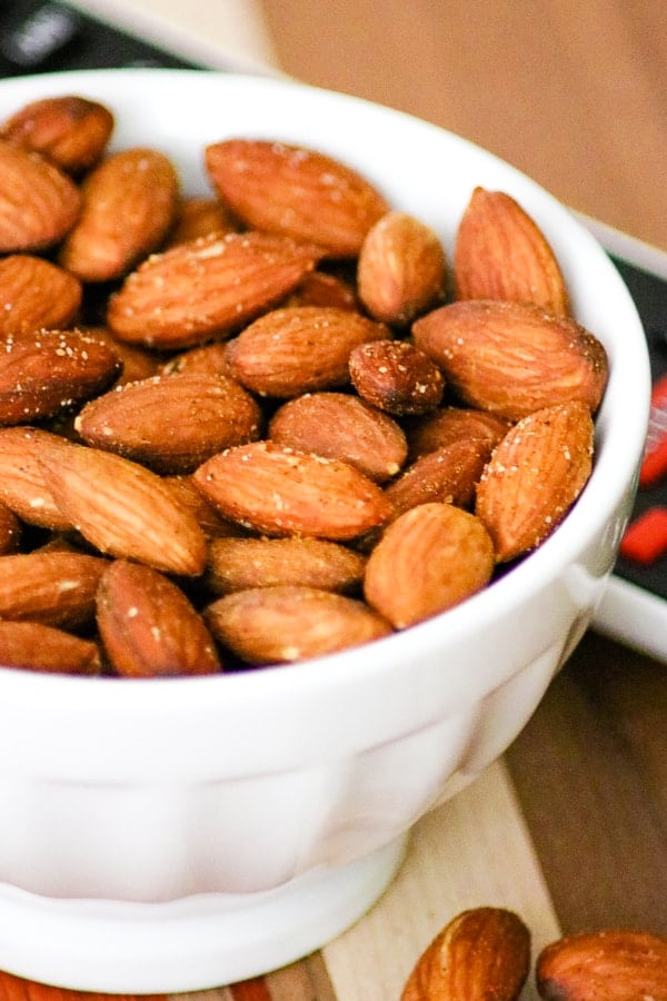 Close-up of a bowl of Baked Spiced Almonds.