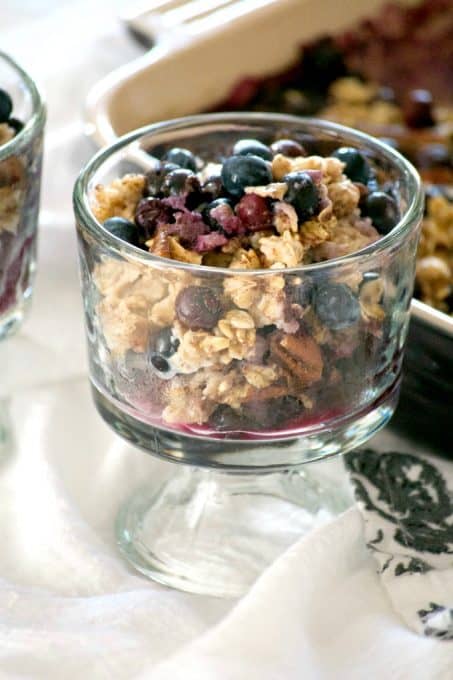 This Baked Blueberry Oatmeal with oats, pecans, cinnamon, milk, honey and blueberries is the perfect for a chilly winter's day. Don't go stovetop, bake it!