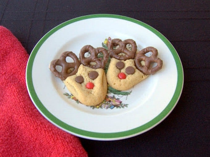 Peanut Butter cookies with chocolate covered pretzels, cinnamon red hots and chocolate chips make these fun holiday cookies!