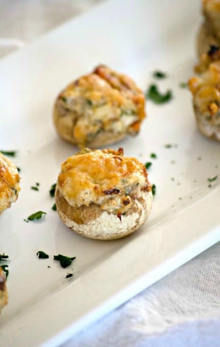 These Cream Cheese Stuffed Mushrooms are button mushrooms filled with cream cheese and a simple season mixture. They're a simple and delicious appetizer that won't last long once they're set out!