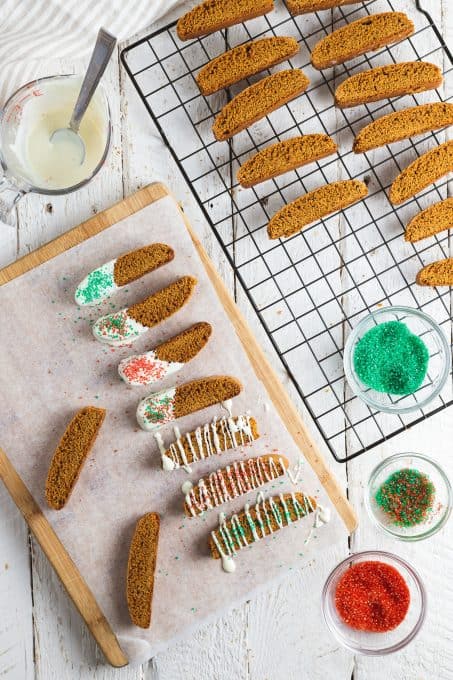 Dipping biscotti cookies in white chocolate
