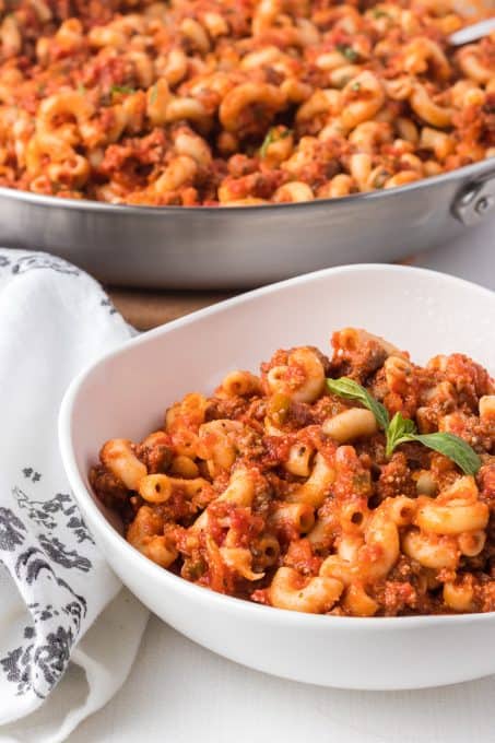 Cooked macaroni with tomato sauce, chopped tomatoes, onion, green pepper and Italian seasoning.