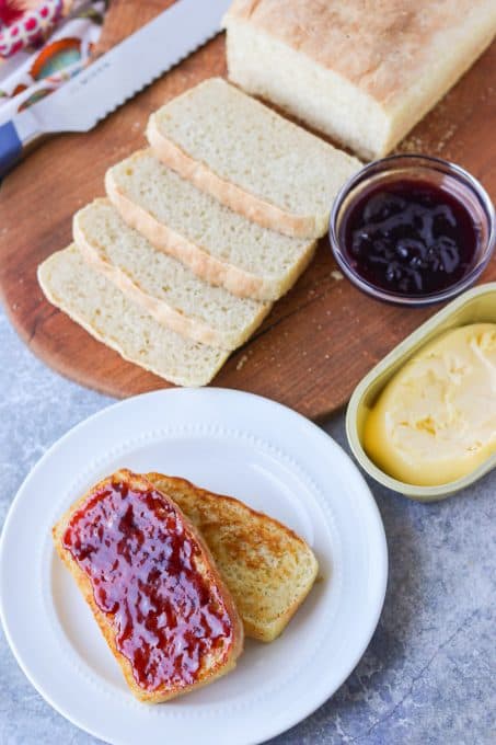 A loaf of English Muffin Bread toasted and spread with jam.