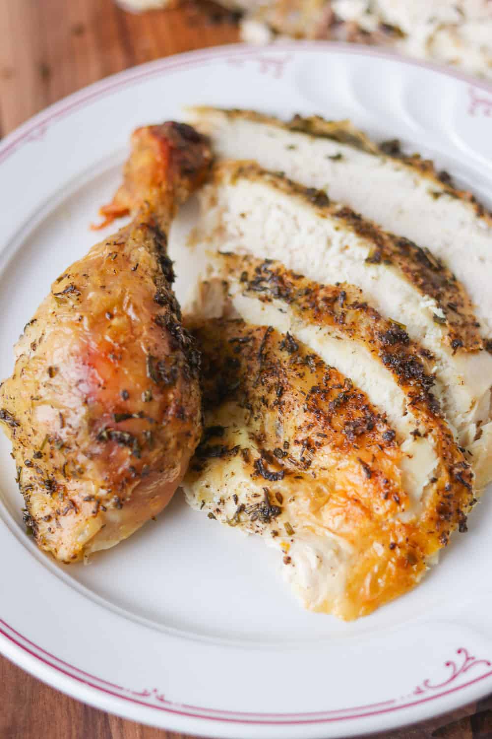 Slices and a drumstick of a Lemon Herb Roasted Chicken.