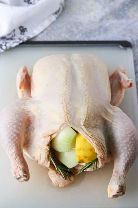 Chicken stuffed with lemon, onion and herbs.