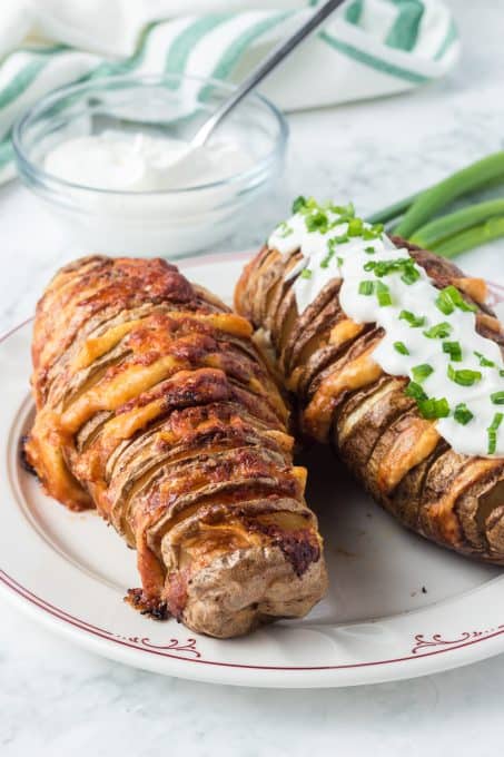 Potatoes filled with slices of Parmesan Cheese.