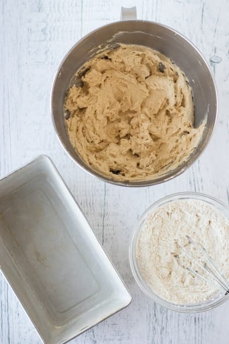 Batter and a loaf pan for a pound cake with brown sugar.