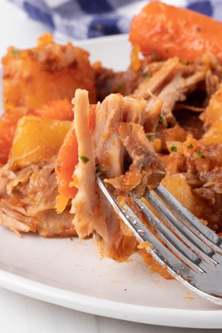 A bite of Spare Ribs made in the slow cooker.