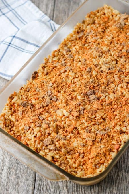 Butterfinger candy bars on top of Rice Krispies treats.