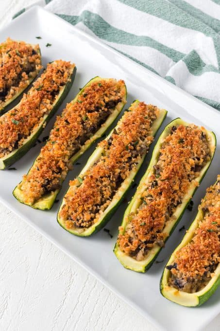 Zucchini stuffed with onions, mushrooms and bread crumbs.