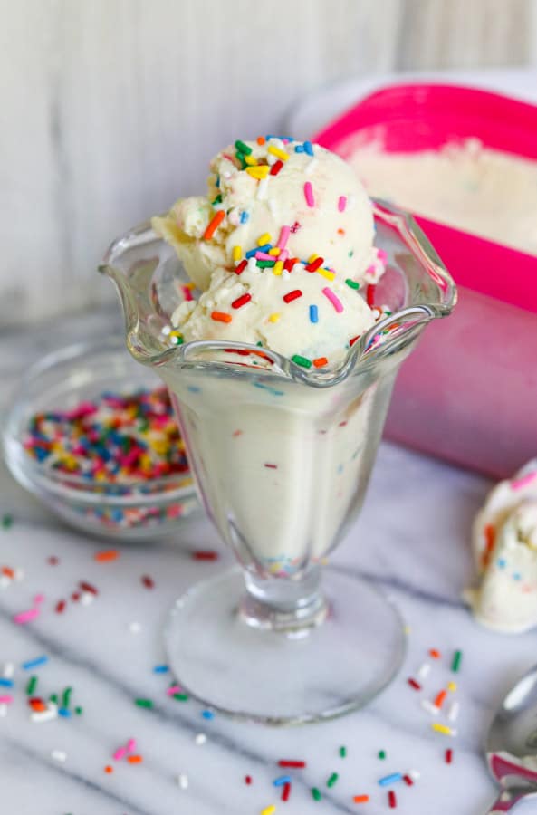 Two scoops of Cake Batter Ice Cream in a dish.