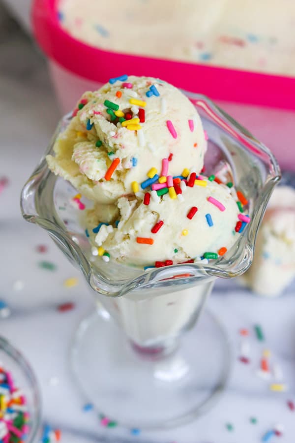 Ice cream scoops of cake batter with sprinkles on top.