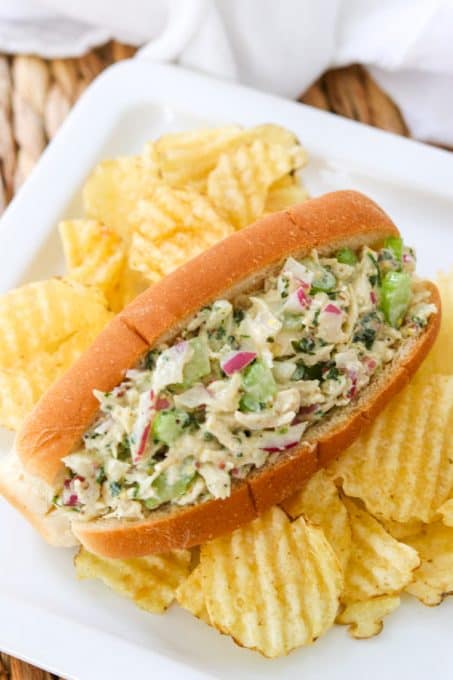 Easy Chicken Salad sandwich on a plate with chips.