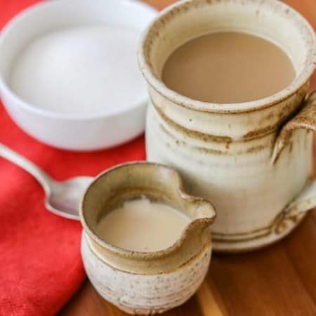 Homemade French Vanilla Coffee Creamer with a cup of coffee.