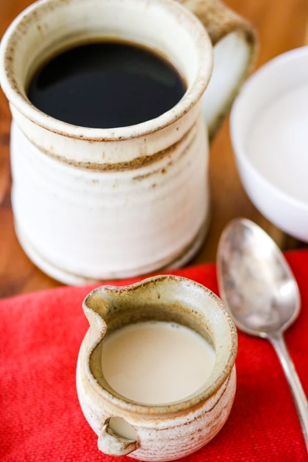 A spoon and Homemade French Vanilla Coffee Creamer.