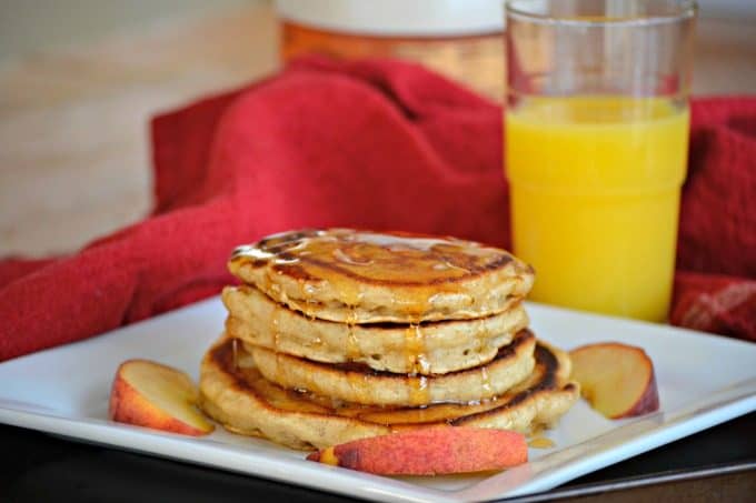 These Cinnamon Peach Pancakes are fluffy buttermilk pancakes spiced with cinnamon and flavored with fresh peaches - a great summer breakfast!