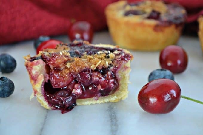 These Blueberry Cherry Mini Crumb Pies contain the fresh tastes of summer in a bite-sized treat!