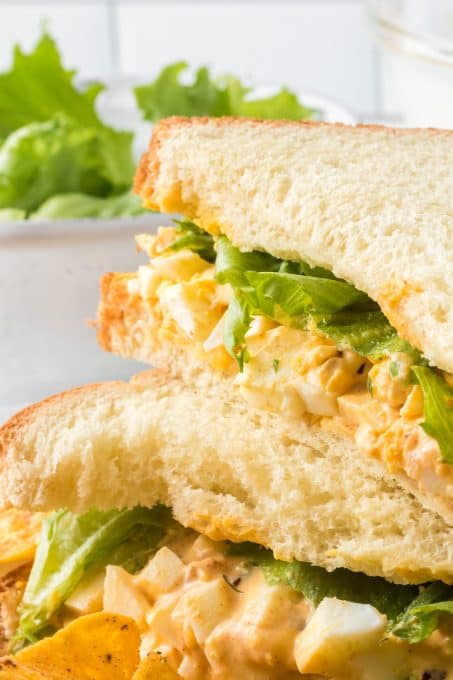 A sandwich of lettuce and egg salad.