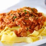 A plate of Crockpot Pork Ragu over some Pappardelle noodles.