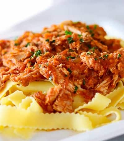 A plate of Crockpot Pork Ragu over some Pappardelle noodles.