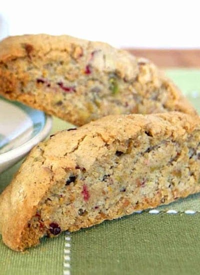 This Cranberry Orange Pistachio Biscotti is an Italian biscuit cookie with the flavors of the holiday season. They will be delicious dunked in a cup of tea or eaten with your morning coffee. 
