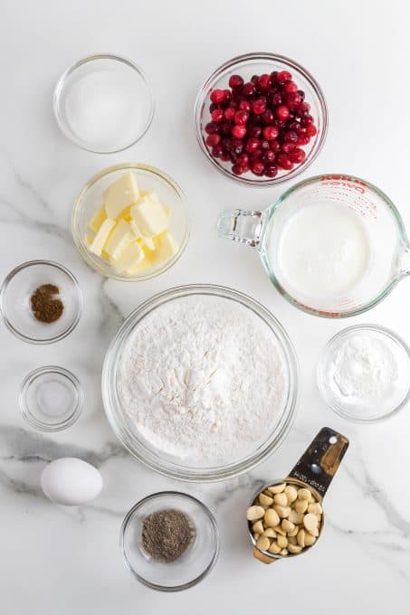 Ingredients for scones with fresh cranberries and chopped macadamia nuts.