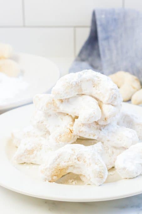 A plate full of almond crescents.