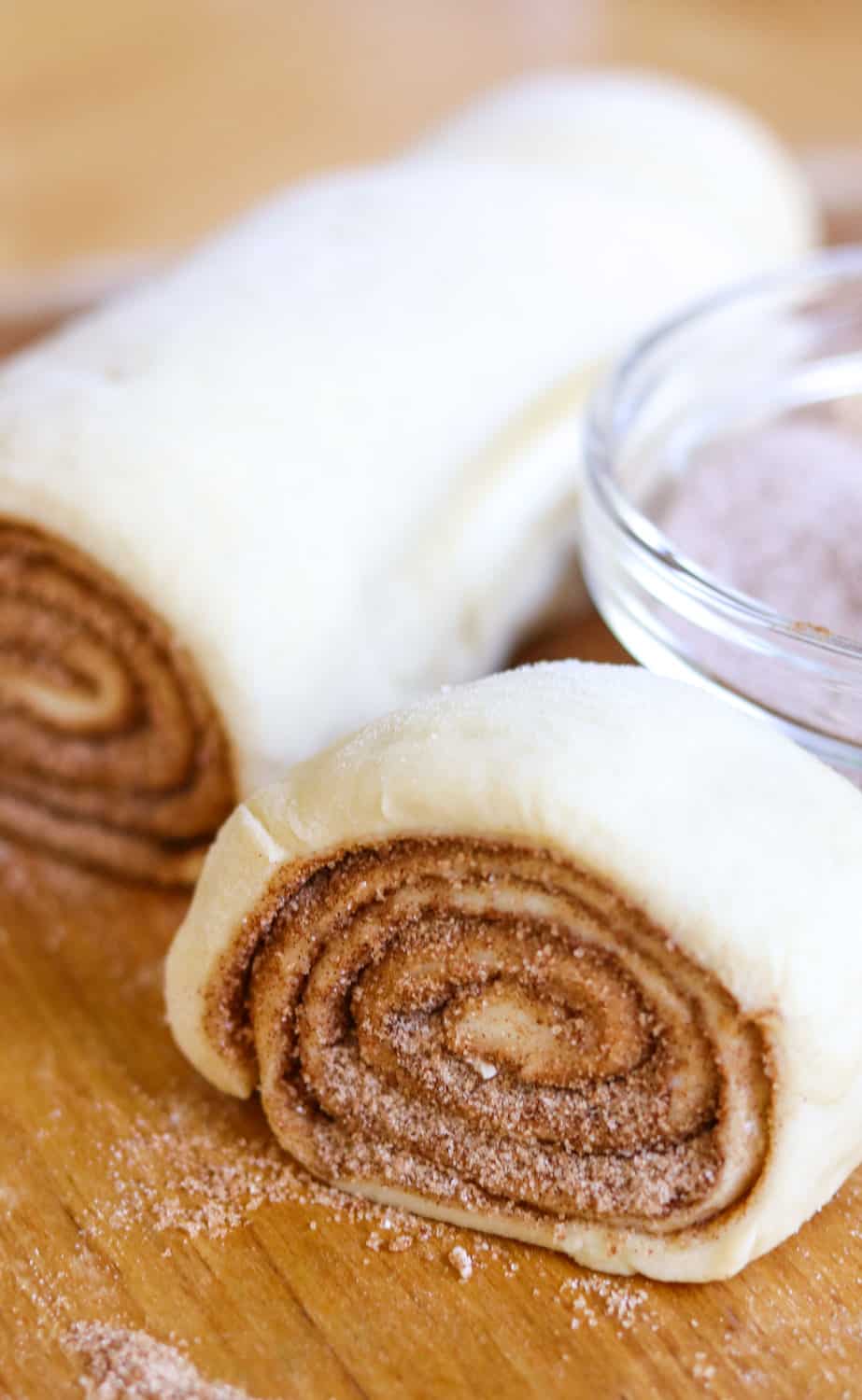 Rolls of dough with cinnamon sugar inside.